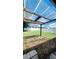 View of backyard featuring patio cover and privacy fence at 221 Fairmont Dr, Spring Hill, FL 34609
