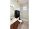 Bathroom with single sink, storage cabinet and bathtub-shower combo at 221 Fairmont Dr, Spring Hill, FL 34609