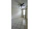 Comfortable bedroom with neutral walls, tile floor, and a window at 221 Fairmont Dr, Spring Hill, FL 34609