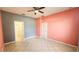 Bedroom with tile floors, ceiling fan, and a connected bathroom at 221 Fairmont Dr, Spring Hill, FL 34609