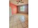 Bedroom with neutral walls, tiled floors, ceiling fan, and natural light at 221 Fairmont Dr, Spring Hill, FL 34609