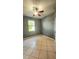 Bedroom with tile flooring, neutral wall color, and natural light at 221 Fairmont Dr, Spring Hill, FL 34609