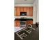 Close-up of the kitchen featuring stainless steel appliances, ample cabinet space, and a double sink at 221 Fairmont Dr, Spring Hill, FL 34609