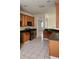Functional kitchen featuring wooden cabinetry, stainless steel appliances, and ample counter space at 221 Fairmont Dr, Spring Hill, FL 34609