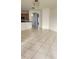 Spacious living area with tile floors offering views of the kitchen and entryway, perfect for entertaining at 221 Fairmont Dr, Spring Hill, FL 34609