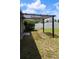 Backyard pergola sitting on a spacious lot, perfect for outdoor entertaining and relaxation at 221 Fairmont Dr, Spring Hill, FL 34609