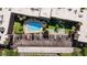 Aerial view showcasing pool, parking, shuffleboard and community amenities at 2525 W Bay Dr # B43, Belleair Bluffs, FL 33770