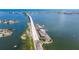 Aerial view of a bridge connecting islands over a body of water with boats and clear skies at 2525 W Bay Dr # B43, Belleair Bluffs, FL 33770