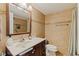 Bathroom features modern tiling, vanity with countertop, framed mirror and shower with curtain at 2525 W Bay Dr # B43, Belleair Bluffs, FL 33770