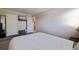 This bedroom has neutral walls, simple furnishings, and a mounted TV at 2525 W Bay Dr # B43, Belleair Bluffs, FL 33770