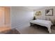 This is a minimalist bedroom with neutral walls, simple furnishings, and a serene atmosphere at 2525 W Bay Dr # B43, Belleair Bluffs, FL 33770