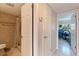 Hallway view of the bathroom entrance, adjacent storage, and secondary entrance at 2525 W Bay Dr # B43, Belleair Bluffs, FL 33770