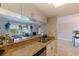 Kitchen with stainless steel appliances, granite countertops, and an open view to the living room at 2525 W Bay Dr # B43, Belleair Bluffs, FL 33770