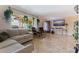 Bright living room features tiled floors, comfortable seating, a TV, and lots of natural light at 2525 W Bay Dr # B43, Belleair Bluffs, FL 33770