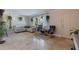 Spacious living room featuring neutral walls, tiled floors, comfortable seating, and natural light at 2525 W Bay Dr # B43, Belleair Bluffs, FL 33770