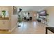 Bright living room with tile floors, comfortable seating, and access to a balcony at 2525 W Bay Dr # B43, Belleair Bluffs, FL 33770
