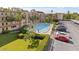 Aerial shot of a condo building featuring manicured lawns, parking, and swimming pool at 2525 W Bay Dr # B43, Belleair Bluffs, FL 33770