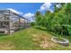 Expansive, screened-in in-ground pool and jacuzzi in landscaped backyard at 26972 Evergreen Chase Dr, Wesley Chapel, FL 33544