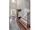 Bright foyer showcasing hardwood flooring, staircase, and high ceilings with natural light at 26972 Evergreen Chase Dr, Wesley Chapel, FL 33544