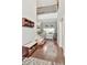 Inviting foyer with hardwood floors, coat rack, and staircase at 26972 Evergreen Chase Dr, Wesley Chapel, FL 33544