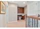 Upstairs landing with a built-in desk and storage in a cozy, carpeted space at 26972 Evergreen Chase Dr, Wesley Chapel, FL 33544