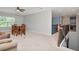 An upstairs sitting area offers a cozy space with a dining table and staircase at 26972 Evergreen Chase Dr, Wesley Chapel, FL 33544