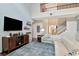 Cozy living room featuring an entertainment center, comfortable seating, and a view of the foyer at 26972 Evergreen Chase Dr, Wesley Chapel, FL 33544