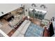 An open-concept living space is equipped with modern decor, a large couch and an island with barstool seating at 26972 Evergreen Chase Dr, Wesley Chapel, FL 33544