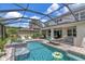 Relaxing screened pool with spa, hammock, and comfortable chairs for ultimate outdoor living at 26972 Evergreen Chase Dr, Wesley Chapel, FL 33544