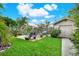 Beautiful backyard area with patio, shed and lawn, ready for outdoor relaxation and enjoyment at 2806 Fairway View Dr, Valrico, FL 33596