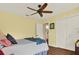 Bright bedroom with hardwood floors, ceiling fan, and a closet at 2806 Fairway View Dr, Valrico, FL 33596