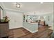 Welcoming entryway with hardwood floors, elegant lighting, and a view into the dining area, creating a warm ambiance at 2806 Fairway View Dr, Valrico, FL 33596
