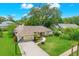 Charming single-Gathering home with a well-kept lawn, circular driveway, and mature trees offering shade and privacy at 2806 Fairway View Dr, Valrico, FL 33596
