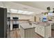 Kitchen featuring stainless steel appliances, granite countertops, and central island at 2806 Fairway View Dr, Valrico, FL 33596