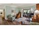 Cozy living room with wood floors, large windows, and access to a screened-in patio, creating an inviting space at 2806 Fairway View Dr, Valrico, FL 33596