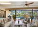 Relaxing screened patio with brick floor, ceiling fans, and poolside seating at 2806 Fairway View Dr, Valrico, FL 33596