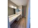Bathroom featuring an extra long vanity and updated lighting at 3007 Wainwright Ct, New Port Richey, FL 34655