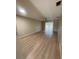 Open-concept living room featuring wood-look flooring and modern ceiling fan at 3007 Wainwright Ct, New Port Richey, FL 34655