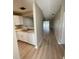 Open living space featuring updated flooring, a kitchen with modern appliances and living area at 3007 Wainwright Ct, New Port Richey, FL 34655