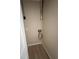 Small utility closet with laminate floor and hook-ups for a washer and dryer at 3007 Wainwright Ct, New Port Richey, FL 34655