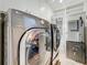 Well-equipped laundry room featuring a washer, dryer, and ample storage space for convenience and organization at 301 23Rd Ne Ave, St Petersburg, FL 33704