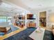 Open-concept living room with hardwood floors, modern decor, and access to the laundry room at 301 23Rd Ne Ave, St Petersburg, FL 33704