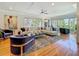 Spacious living room features hardwood floors, a large sectional, and abundant natural light at 301 23Rd Ne Ave, St Petersburg, FL 33704