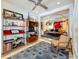 Cozy living room featuring hardwood floors, shelving, accent chair and an open-concept design at 301 23Rd Ne Ave, St Petersburg, FL 33704