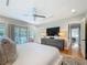 This main bedroom features wood floors, neutral walls, and access to the backyard at 301 23Rd Ne Ave, St Petersburg, FL 33704