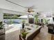 Relaxing outdoor living space with a small pool, lounge area, and outdoor dining set at 301 23Rd Ne Ave, St Petersburg, FL 33704