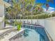 Beautiful pool with lush landscaping and palm trees offering a private and serene oasis at 301 23Rd Ne Ave, St Petersburg, FL 33704