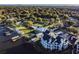 Aerial view showcases the community and lakefront access with docks at 3127 W Sligh Ave # 303B, Tampa, FL 33614