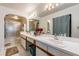 Bright bathroom with double sinks, updated fixtures, and enclosed shower at 3127 W Sligh Ave # 303B, Tampa, FL 33614