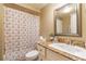 Well-maintained bathroom features a decorative mirror and a granite countertop at 3127 W Sligh Ave # 303B, Tampa, FL 33614